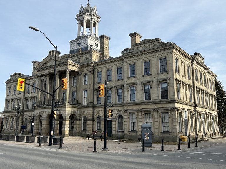 Cobourg Real Estate. Cobourg Town Hall II, a historic building with intricate brickwork and a stately presence, positioned in the heart of Cobourg, enhancing the town's heritage.