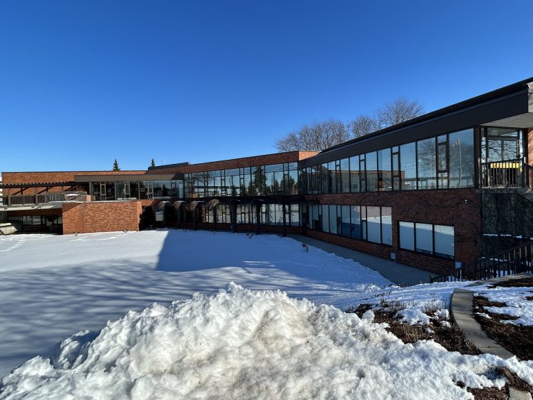 Whitby Real Estate: Whitby Town Hall, an architectural gem with historic charm, featuring a detailed brick facade and classic design, centrally located in the heart of Whitby.